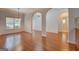 Bright dining area showcasing hardwood floors, neutral walls, and elegant chandelier at 9187 Golfside Cir, Covington, GA 30014