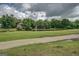 Scenic view of a home situated by a serene lake with lush greenery at 9187 Golfside Cir, Covington, GA 30014