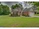 Traditional brick home with an attached two car garage and a beautifully landscaped yard at 9187 Golfside Cir, Covington, GA 30014