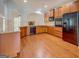 Modern kitchen featuring stainless steel appliances, granite countertops, and hardwood floors at 9187 Golfside Cir, Covington, GA 30014
