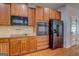 Stylish kitchen showcasing stainless steel appliances and light granite countertops at 9187 Golfside Cir, Covington, GA 30014
