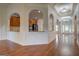 Elegant living space with hardwood floors, decorative trim, and open layout at 9187 Golfside Cir, Covington, GA 30014