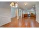 Spacious living area with hardwood floors, decorative trim, and open floor plan at 9187 Golfside Cir, Covington, GA 30014
