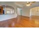 Spacious living area with hardwood floors, arched doorways, and a view into the breakfast nook at 9187 Golfside Cir, Covington, GA 30014