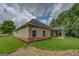 Home with a well maintained lawn and a covered patio at 9187 Golfside Cir, Covington, GA 30014