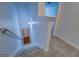 Carpeted stairway leading to a lower level with white walls at 9187 Golfside Cir, Covington, GA 30014