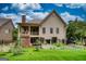 Exterior view of the back of the house with well-maintained lawn and landscaping at 705 Lawton Bridge Sw Rd, Smyrna, GA 30082