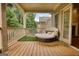 Relaxing covered balcony with outdoor furniture and views of the backyard at 705 Lawton Bridge Sw Rd, Smyrna, GA 30082