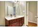 Bathroom with a dark wood vanity and sink with a large mirror above at 705 Lawton Bridge Sw Rd, Smyrna, GA 30082