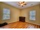 Bedroom with hardwood floors, two windows, and ceiling fan at 705 Lawton Bridge Sw Rd, Smyrna, GA 30082