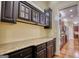 Kitchen area featuring dark wood cabinetry, granite counters, and hardwood floors at 705 Lawton Bridge Sw Rd, Smyrna, GA 30082