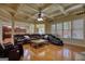 Open living room with hardwood floors, fireplace, and views of the kitchen and backyard at 705 Lawton Bridge Sw Rd, Smyrna, GA 30082
