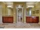 Large main bathroom with dual vanities, tiled floors, and a doorway leading into the main bedroom at 705 Lawton Bridge Sw Rd, Smyrna, GA 30082