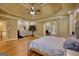 Spacious main bedroom with a trey ceiling, an adjacent office area, and beautiful hardwood flooring at 705 Lawton Bridge Sw Rd, Smyrna, GA 30082