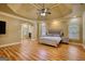 Spacious bedroom with trey ceiling, fireplace, and large windows for plenty of natural light at 705 Lawton Bridge Sw Rd, Smyrna, GA 30082