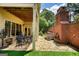 Outdoor patio area with hot tub, fireplace, and table and chairs at 705 Lawton Bridge Sw Rd, Smyrna, GA 30082