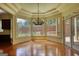 Bright sunroom with hardwood floors, large windows, and a chandelier at 705 Lawton Bridge Sw Rd, Smyrna, GA 30082