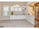 Bright living area featuring built-in cabinets and an open view to the kitchen at 444 Silverbell Ct, Peachtree City, GA 30269