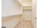 Walk-in closet with built-in shelving and carpet at 444 Silverbell Ct, Peachtree City, GA 30269