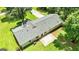 An aerial view of the house featuring a new roof, a patio area, and a spacious backyard at 125 Selena Ct, Fayetteville, GA 30215