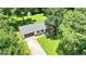 Aerial view showcases a home's beautiful landscaping, mature trees, and spacious driveway at 125 Selena Ct, Fayetteville, GA 30215