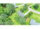 Aerial view of a home surrounded by lush greenery in a tranquil residential neighborhood at 125 Selena Ct, Fayetteville, GA 30215