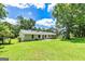 The backyard features a well-maintained lawn and an open patio, providing an ideal space for outdoor activities at 125 Selena Ct, Fayetteville, GA 30215