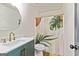 This bathroom has a vanity with a gold faucet and a shower with a decorative shower curtain at 125 Selena Ct, Fayetteville, GA 30215