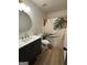 Modern bathroom featuring stylish shower curtain, round mirror, and elegant vanity at 125 Selena Ct, Fayetteville, GA 30215