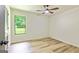 This bedroom has light wood floors and a nice window to see the backyard at 125 Selena Ct, Fayetteville, GA 30215
