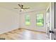 This bedroom features light wood floors and two nice windows that let in great sunlight at 125 Selena Ct, Fayetteville, GA 30215