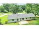 An aerial view of the house with a new roof, back patio and landscaped backyard at 125 Selena Ct, Fayetteville, GA 30215