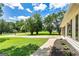 Well-maintained front yard with lush landscaping and a view of the house siding, inviting curb appeal at 125 Selena Ct, Fayetteville, GA 30215