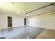 Spacious garage includes ample storage and a gray and white tiled floor at 125 Selena Ct, Fayetteville, GA 30215