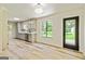 Kitchen area with modern gray cabinets, stainless appliances, and views of the backyard from the window at 125 Selena Ct, Fayetteville, GA 30215