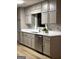 Well-lit kitchen featuring stainless steel appliances, neutral-toned cabinets, and sleek countertops at 125 Selena Ct, Fayetteville, GA 30215