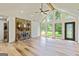 Bright living room with a stone fireplace, large windows and high ceilings, creating a spacious and inviting atmosphere at 125 Selena Ct, Fayetteville, GA 30215