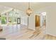 Expansive living area featuring vaulted ceilings, wood floors, large windows, and an open layout for entertaining at 125 Selena Ct, Fayetteville, GA 30215
