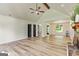 Spacious living room with light-colored walls, vaulted ceiling, wood floors, and a beautiful stone fireplace at 125 Selena Ct, Fayetteville, GA 30215