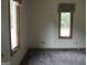 Bedroom featuring natural light and neutral decor, ready for personalization at 1455 River Cove Rd, Social Circle, GA 30025