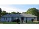 Inviting single story home with a charming walkway and beautiful front yard landscaping at 1455 River Cove Rd, Social Circle, GA 30025