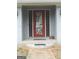 Exterior front entrance featuring a beautiful glass-paneled door and walkway at 1455 River Cove Rd, Social Circle, GA 30025