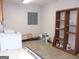 Functional laundry area with washer and shelving for storage solutions at 1455 River Cove Rd, Social Circle, GA 30025
