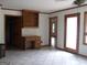 Bright living room features tile flooring and built-in shelving perfect for storage at 1455 River Cove Rd, Social Circle, GA 30025