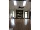 Spacious living room with a vaulted ceiling, skylights, and stone fireplace for cozy gatherings at 1455 River Cove Rd, Social Circle, GA 30025