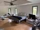 Spacious main bedroom featuring a sitting area, tray ceiling and natural light at 1455 River Cove Rd, Social Circle, GA 30025