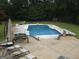 Backyard pool with lounge seating and an umbrella-covered table at 1455 River Cove Rd, Social Circle, GA 30025