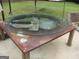 A repurposed fan stands as a glass-topped table at 1455 River Cove Rd, Social Circle, GA 30025