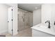 Modern bathroom featuring a walk-in shower with a glass door and double sink vanity at 676 Cantrell Drive, Dallas, GA 30157