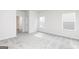 Bright bedroom with neutral carpet and two windows at 280 Limestone Circle, Conyers, GA 30013